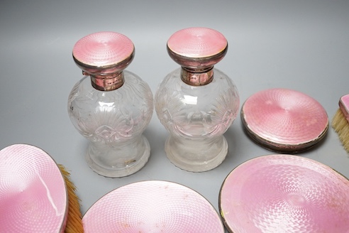 A George silver and enamel mounted glass part dressing table set, by Henry Clifford Davis and a similar American hand mirror.